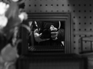 black girl covering face blurry aesthetic mirror selfie